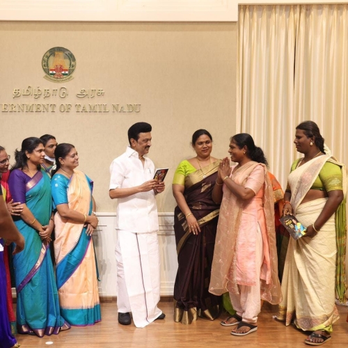 Sudha giving her book to the Chief Minister of Tamilnadu